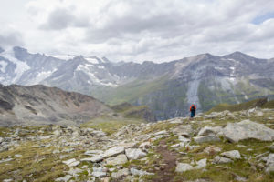 Mountaineer descending from the Tracuit hut, weak and exhausted Mountaineer descending from the Tracuit hut, weak and exhausted